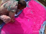 Worker preparing Gulal for Holi
