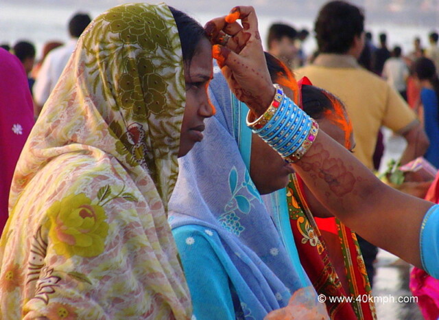 Woman Applying Vermillion - Chhath Festival, Juhu Beach, Mumbai, Maharashtra, India