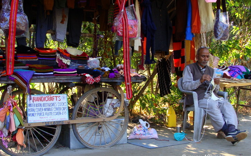 Man Knitting Sweater at Ganga Lane, Swarg Ashram, Rishikesh, Uttarakhand, India