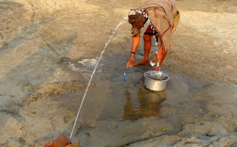 Different Way to Save Water for Brushing Teeth at Maha Kumbh Mela - 2013, Allahabad, Uttar Pradesh, India