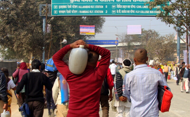 Kumbh Mela Devotee Carrying Holy Ganga Water at Kumbh Mela 2013, Allahabad, Uttar Pradesh, India
