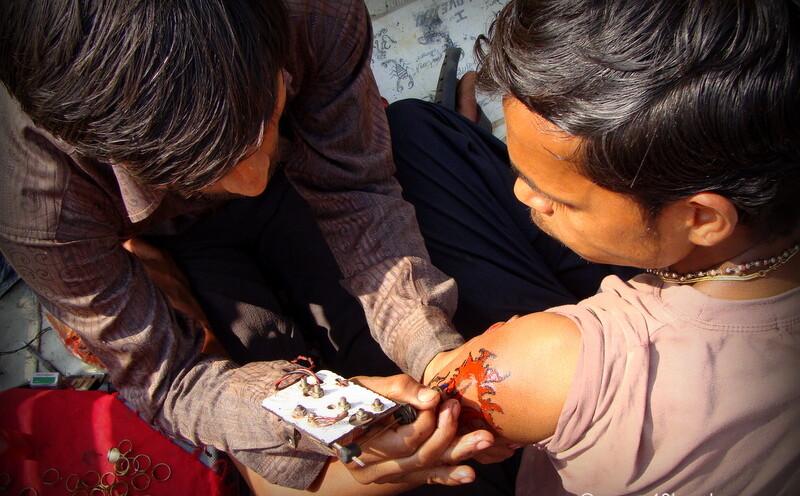 Making Tattoo with Traditional Machine in Barsana, Uttar Pradesh, India
