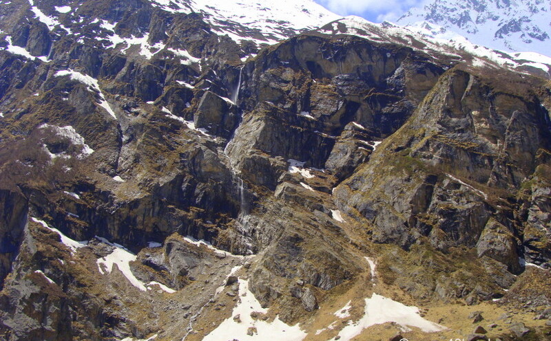 Mountain Winter Snow Melting Creating a Small Waterfall near Mana Village, Uttarakhand, India