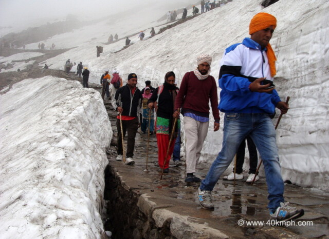 Pilgrims Trekking in Snowy Mountains, Hemkund, Uttarakhand, India