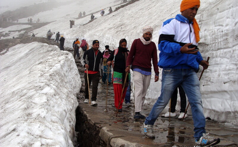Pilgrims Trekking in Snowy Mountains, Hemkund, Uttarakhand, India