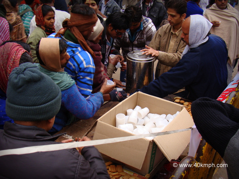 Free Tea and Biscuits for Pilgrims on the Occasion of Makar Sankranti at Dashashwamedh Ghat Road, Varanasi, Uttar Pradesh, India