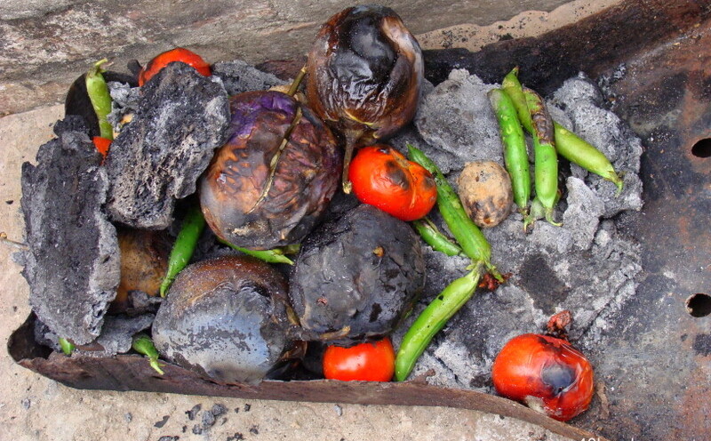 Roasting Baingan for Bharta on the Occasion of Makar Sankranti