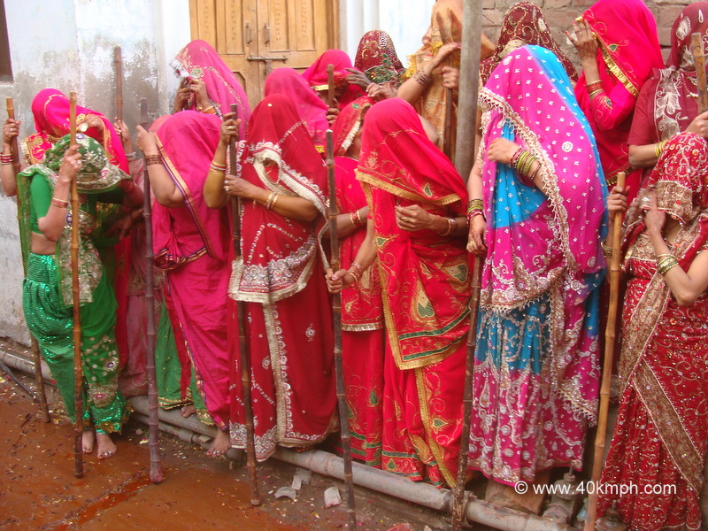 Huriyarine with Wooden Sticks during Lathmar Holi at Nandgaon, Uttar Pradesh