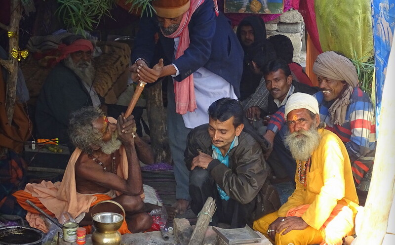 Sadhu Smoking Chillum at Bhavnath Fair 2015 in Junagadh, Gujarat, India