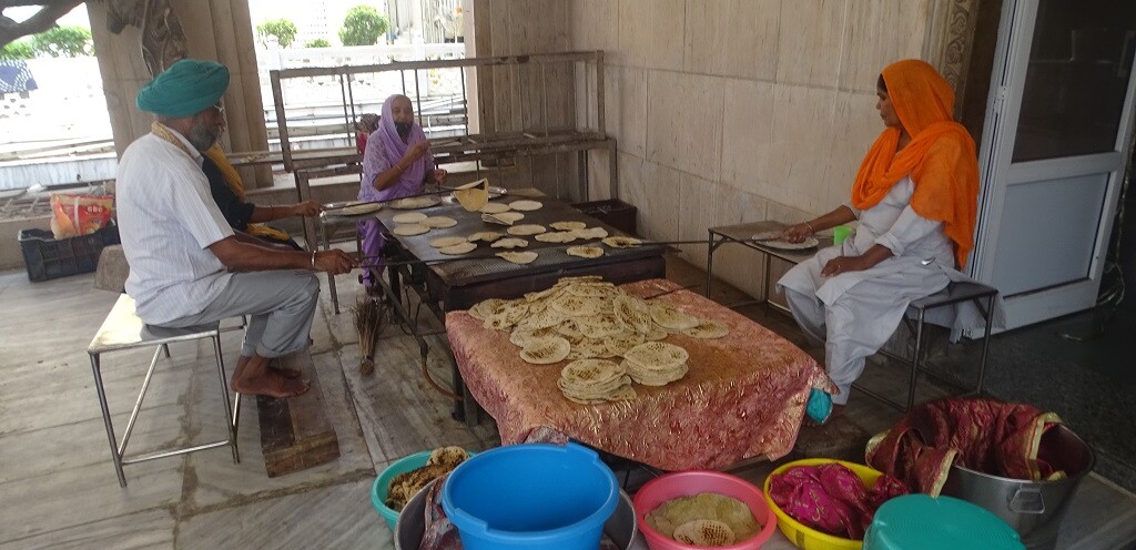 Gurudwara Sis Ganj Sahib (Chandni Chowk Road, Old Delhi, India) Volunteers Making Rotis at Community Kitchen