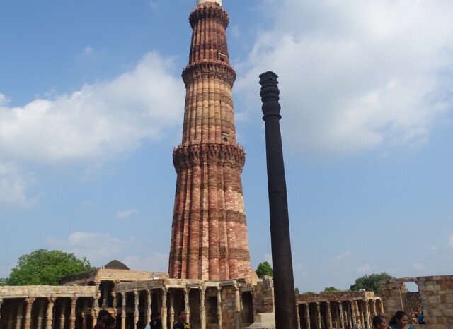 Iron Pillar and Qutb Minar at Qutb Complex, Delhi, India