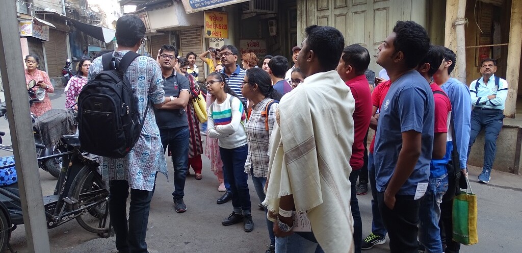 Tourist during Ahmedabad (Gujarat, India) Morning Heritage Walk with Professional Tour Guide