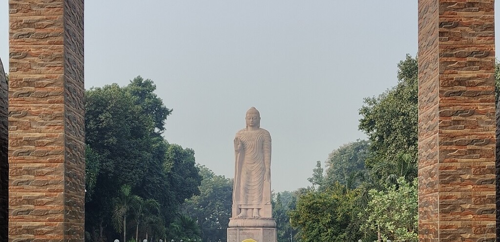 The Standing Buddha Framed Through Arched Entrance (Wat Thai Sarnath Temple, Uttar Pradesh, India)