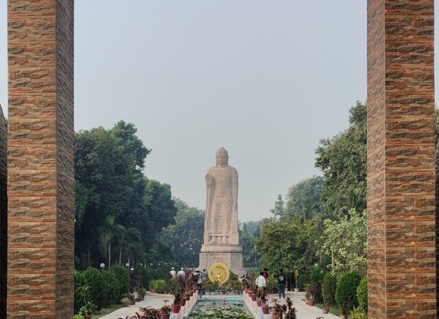 The Standing Buddha Framed Through Arched Entrance (Wat Thai Sarnath Temple, Uttar Pradesh, India)